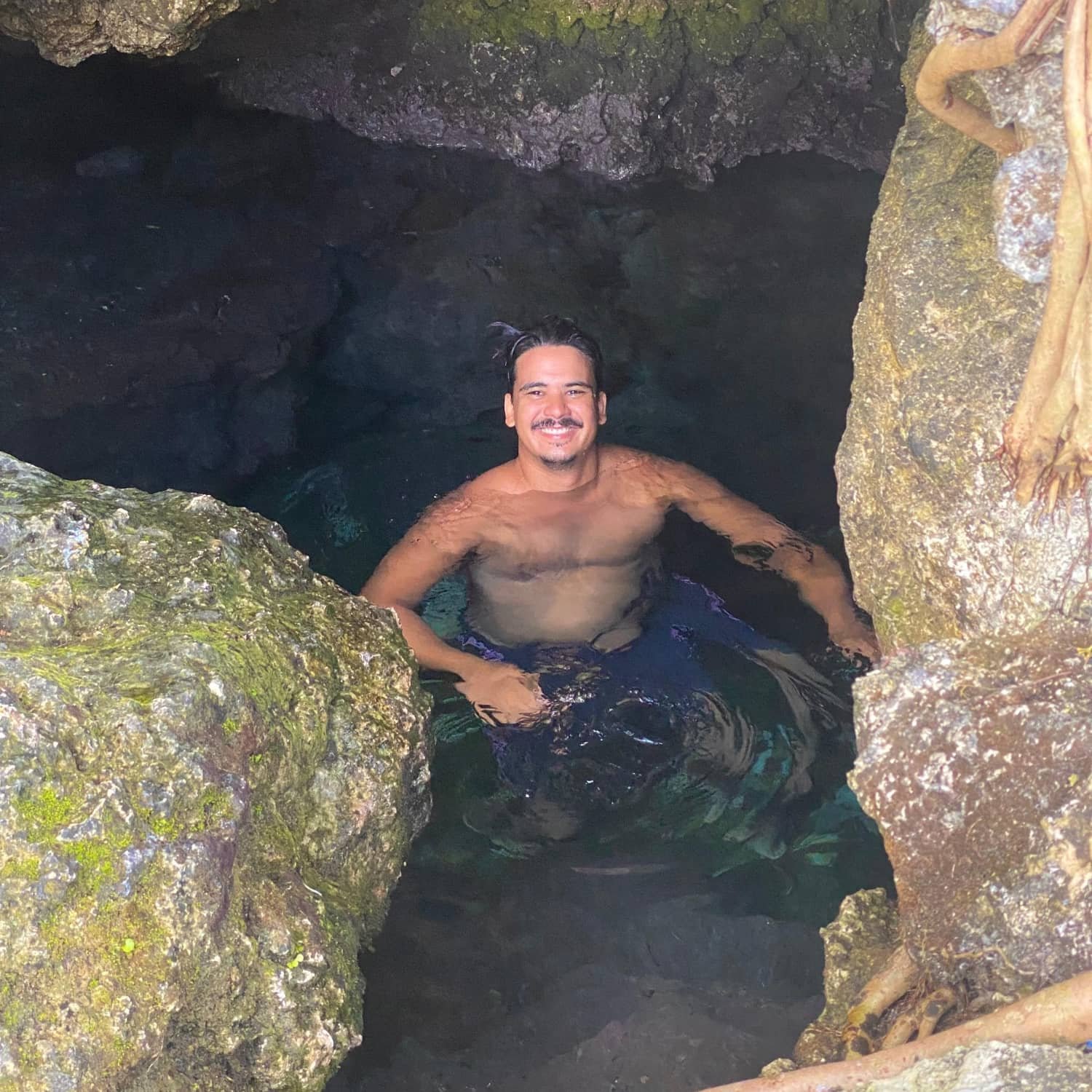 jamie enjoying the cold spring in pacifico, siargao, philippines